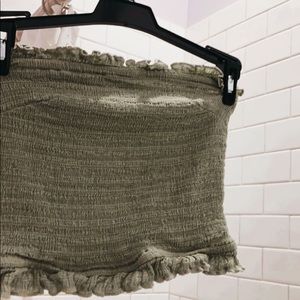 a bright green frilly urban outfitters tube top